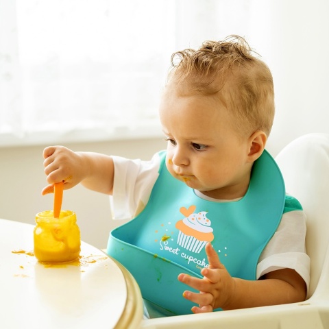 Śliniak silikonowy Canpol z kieszenią regulowany zapinany turkusowy 4+